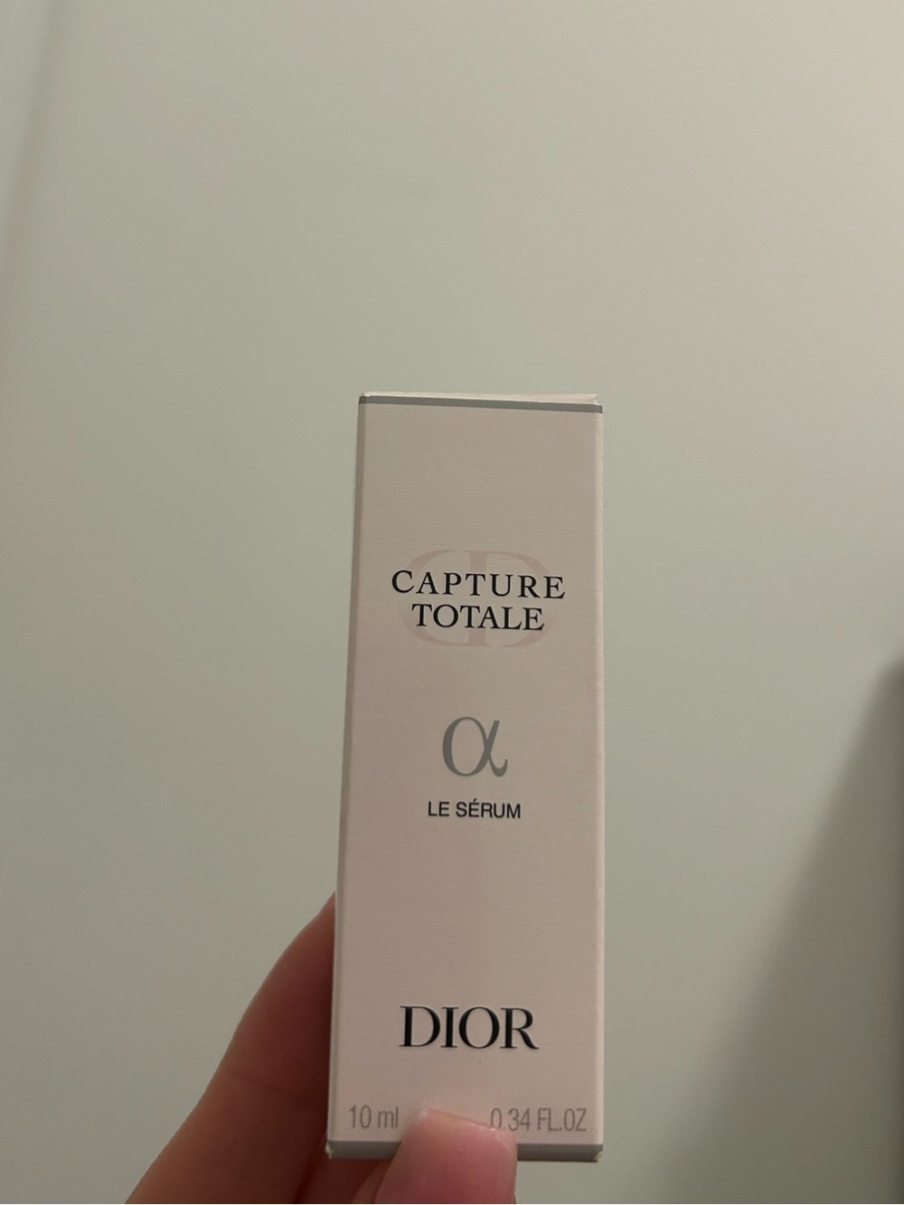 Dior pale pink skincare box with black text